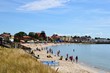 Hel, Hel Peninsula, Poland. People relaxing at the beach in Hel. Late summer day at sandy beach in Hel town.