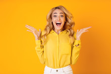 Excited Millennial Woman Screaming Over Yellow Background