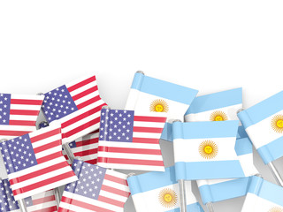 Pins with flags of United States and argentina isolated on white