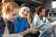 © Prostock-studio - College students studying outdoor, preparing for exams