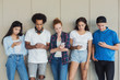 © Prostock-studio - Teens using cellphones, disinterested to each other