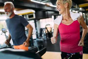 Picture of senior people running on treadmill in gym