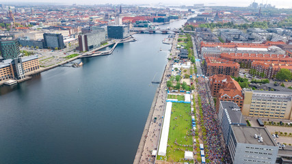 Wall Mural - Marathon running race, aerial view of start and finish line with many runners from above, road racing, sport competition, Copenhagen marathon, Denmark