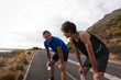 © Wavebreak Media - Father and son with water bottle standing on road