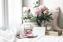 Spring, Summer Wedding Still Life Scene. Blank Paper Card Mockup, Old Books And Linen Pillow At Windowsill. Vintage Feminine Floral Composition. Bouquet Of Pink Roses, Peony Flowers And Eucalyptus.