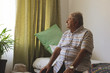 © Wavebreak Media - Senior man looking outside the window while sitting alone at nursing home
