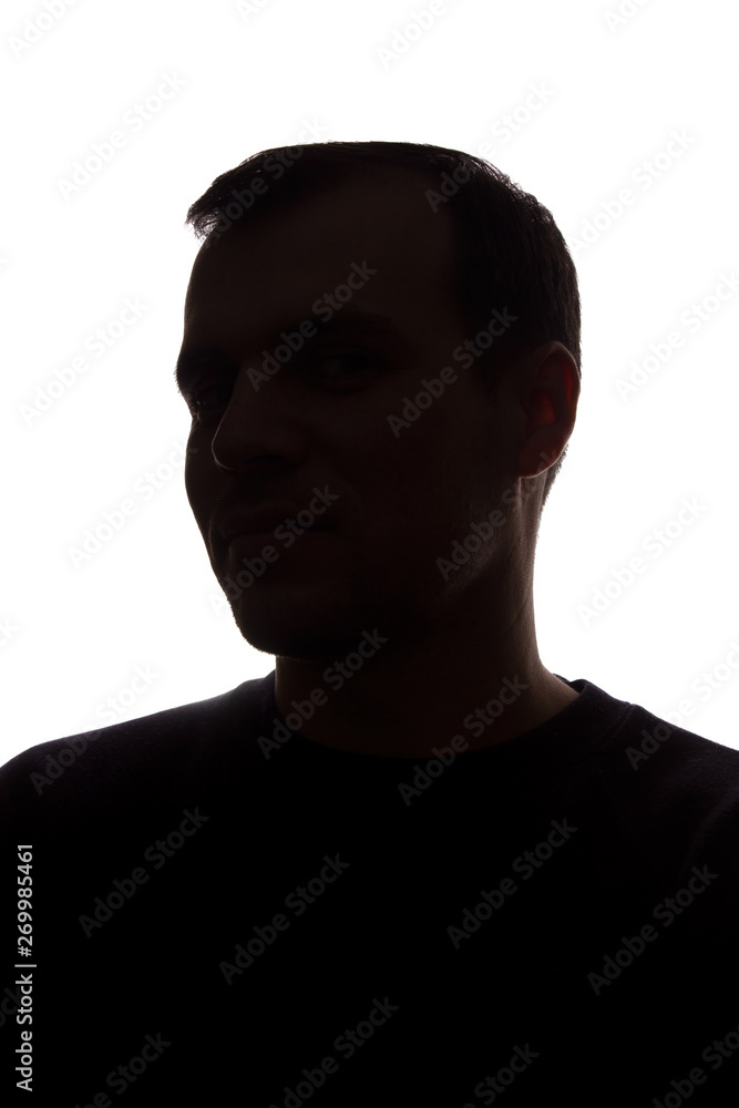 Portrait of a young man, side view - dark isolated silhouette - obrazy, fototapety, plakaty 