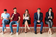 © Pixel-Shot - Young people waiting for job interview indoors