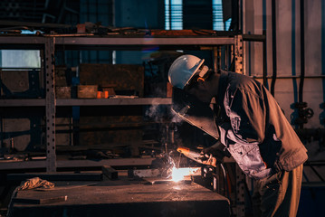 Wall Mural - Welding metal at heavy industry factory.