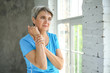 © Pixel-Shot - Mature woman suffering from pain in wrist at home