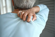 © Pixel-Shot - Mature woman suffering from back pain, closeup