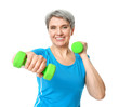 © Pixel-Shot - Sporty mature woman with dumbbells on white background