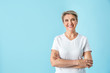 © Pixel-Shot - Sporty mature woman on color background
