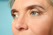 © Pixel-Shot - Portrait of mature woman on color background, closeup