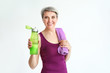 © Pixel-Shot - Sporty mature woman with bottle of water and towel on white background