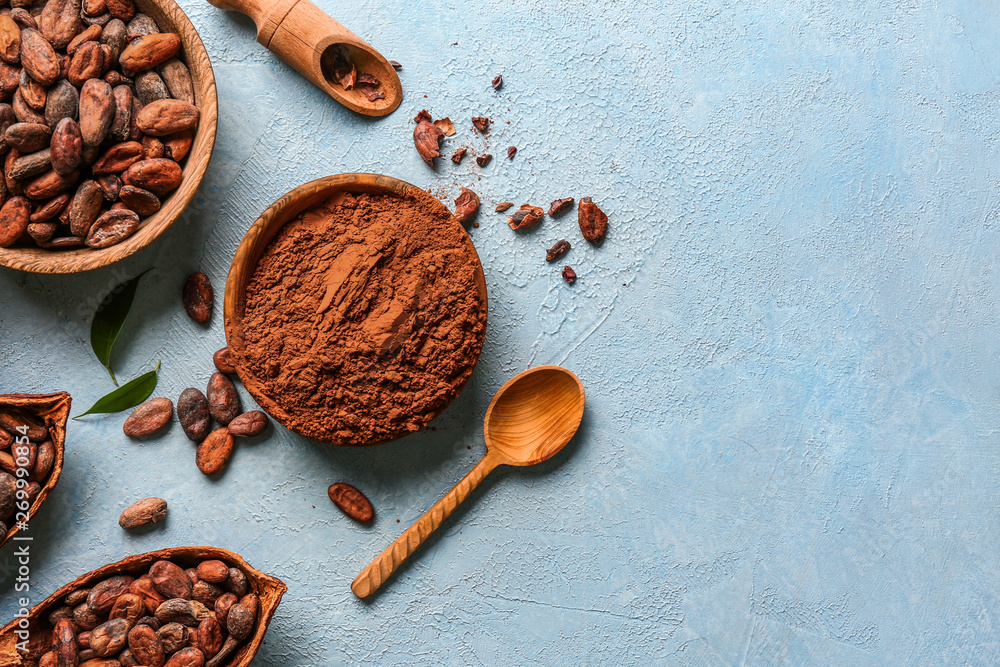 Composition with cocoa powder and beans on color background - obrazy, fototapety, plakaty 