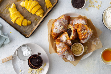 Wall Mural - Fresh croissants with chocolate on a white background top view