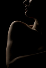 Portrait Silhouette Of Young Sensual Woman On Dark Background