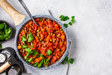 Vegan Bean Stew With Tomatoes In A Pan Over White Background.