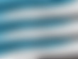 © Garry Basnett - Abstract blue to grey striped textured background pattern.