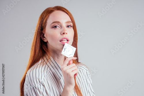 Fotomural picture of young redhead be lost in thought businesswoman in striped shirt with