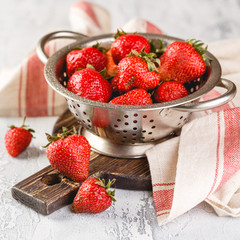 Wall Mural - Fresh strawberries in a while colander