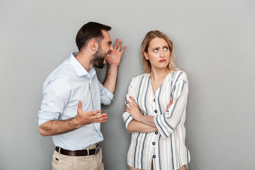 Photo of european couple in casual clothes arguing and screaming