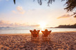 Leinwandbild Motiv romantic getaway for couple, beach honeymoon travel, silhouettes of man and woman relaxing in hotel