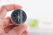 © TECHNOLOGY FACTORY - man holding compass on blurred background. for activity lifestyle
