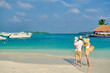 © haveseen - Family on beach, young couple with three year old boy. Summer vacation at Maldives.