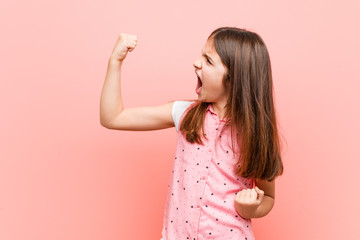 Sticker - Cute little girl raising fist after a victory, winner concept.