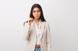 © Asier - Young business arab woman isolated against a white background showing number one with finger.