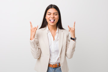 Young business arab woman isolated against a white background showing rock gesture with fingers