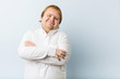 © Asier - Young authentic redhead fat man who feels confident, crossing arms with determination.