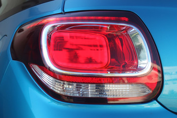 Rear light cluster of blue vehicle