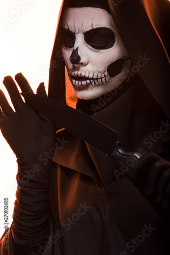 Woman With Skull Makeup Holding Knife Isolated On White Buy This