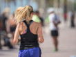 Photo of a woman running blond hair