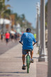 Image of a senior man riding a bike on Hollywood Beach FL