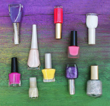 Assorted Nail Polishes On Wooden Background