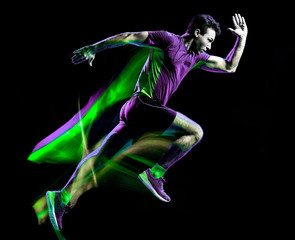Wall Mural - one caucasian runner running jogger jogging man light painting speed effect isolated on black backgr