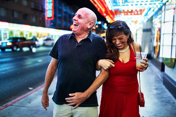 mature couple sightseeing in downtown las vegas streets