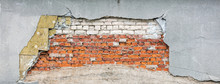 Fragment Of Old Destroyed Wall With Damaged Bricks, Insulation Wool And Rough Shabby Stucco Layer. House Renovation Concept