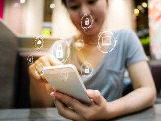 Wall Mural - Woman using smartphone with icon graphic cyber security network of connected devices and personal data information