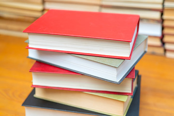 Stack of books in the library. Symbol of knowledge and learning.