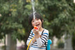 © lalalululala - Cute Asian child playing with water gun in the summer