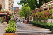 Belgrade, Serbia - June 16, 2018. Flowers in pots on historic place Skadarlija with trees, cafes, cobbled lanes and alleys in downtown. Bohemian street with bars and restaurants.