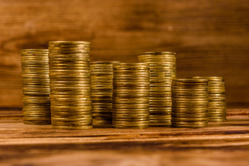 Stacks of the coins on wooden table