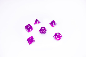 Wall Mural - Purple dices for fantasy dnd and rpg tabletop games. Board game polyhedral dices with different sides isolated on white background