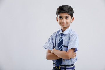 Wall Mural - Cute little indian Indian / Asian school boy wearing uniform