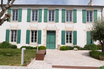 Wall Mural - isle ile de Re France picturesque village center white house and green shutter